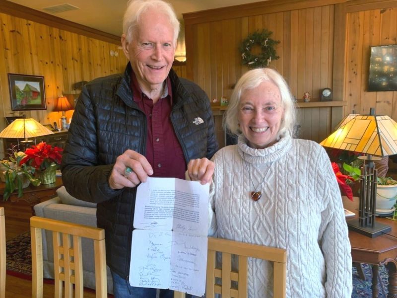 Joan and Jeff delicately holding the Cambridge Declaration